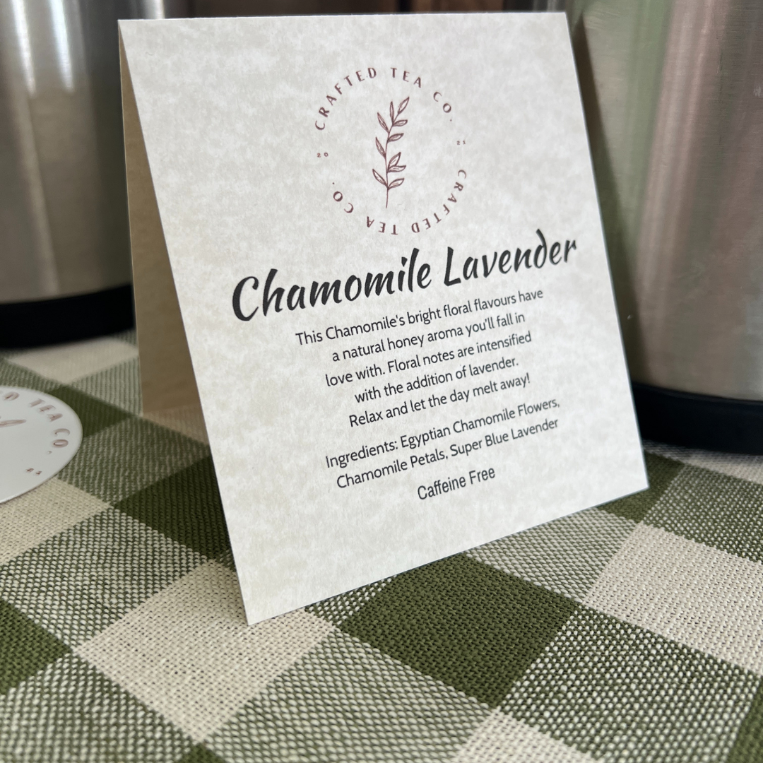 Chamomile Lavender tea label with branding and product details on a checkered tablecloth.