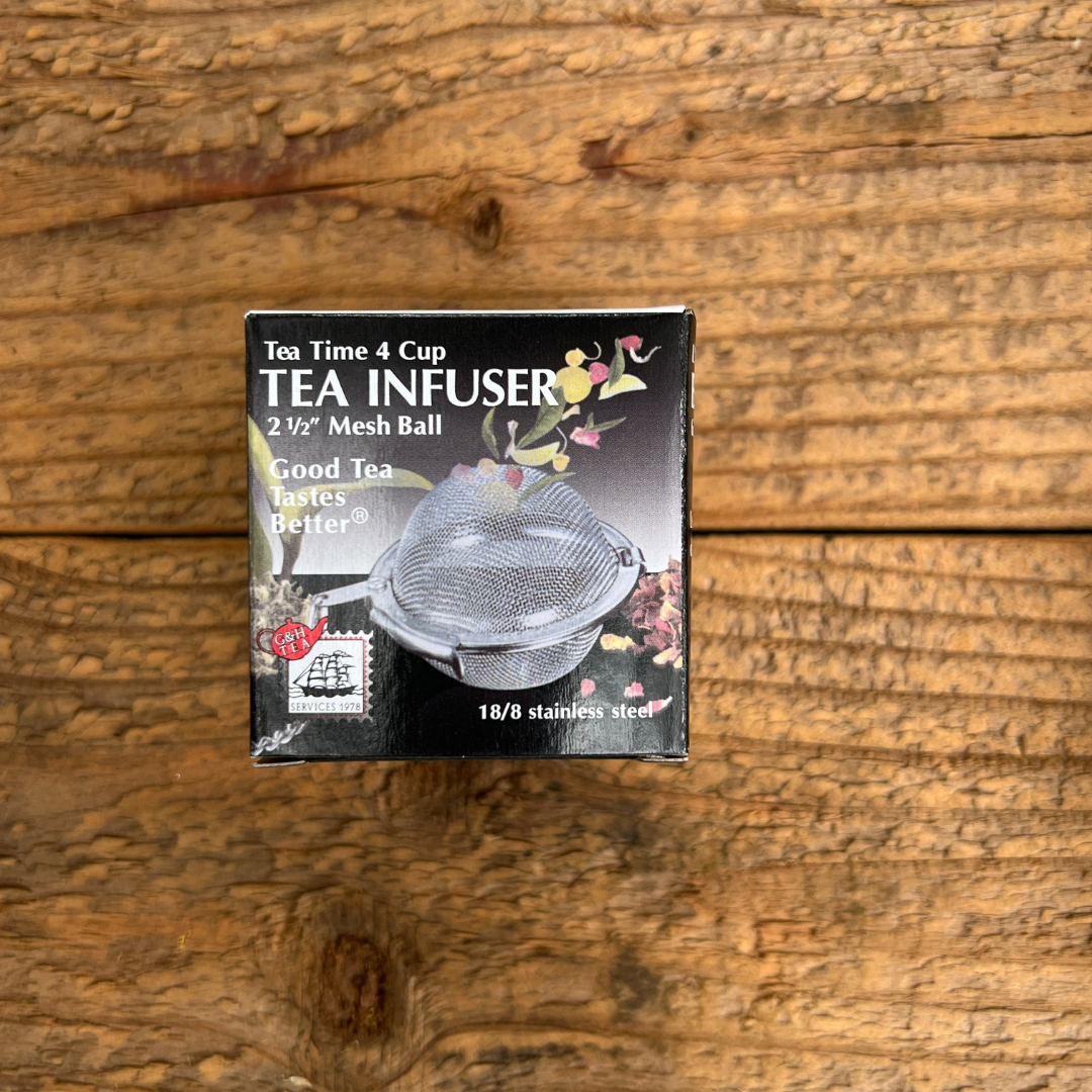 tea ball in box on wooden board