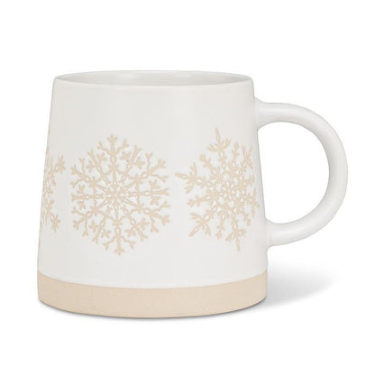 White mug with beige snowflake patterns on a white background