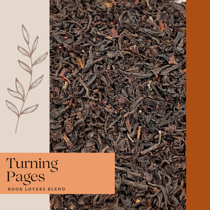 Tea leaves with 'Turning Pages' book blend label on an orange background