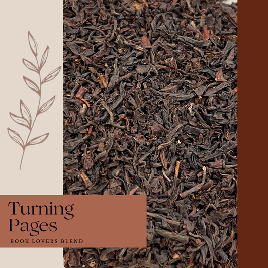 Dark brown tea leaves with product name Turning Pages on burgundy background