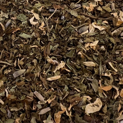 close up of dried herbal tea ingredients lemon balm, lavender, chamomile petals, peppermint