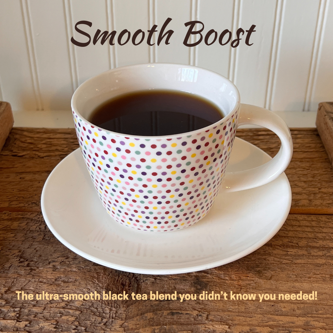 Cup of brewed black tea on a saucer placed on a wooden tray